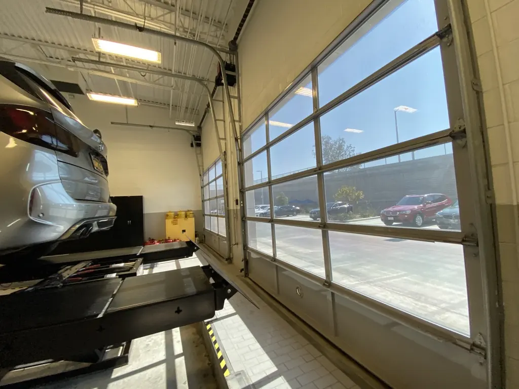 Glass service-bay doors with window film