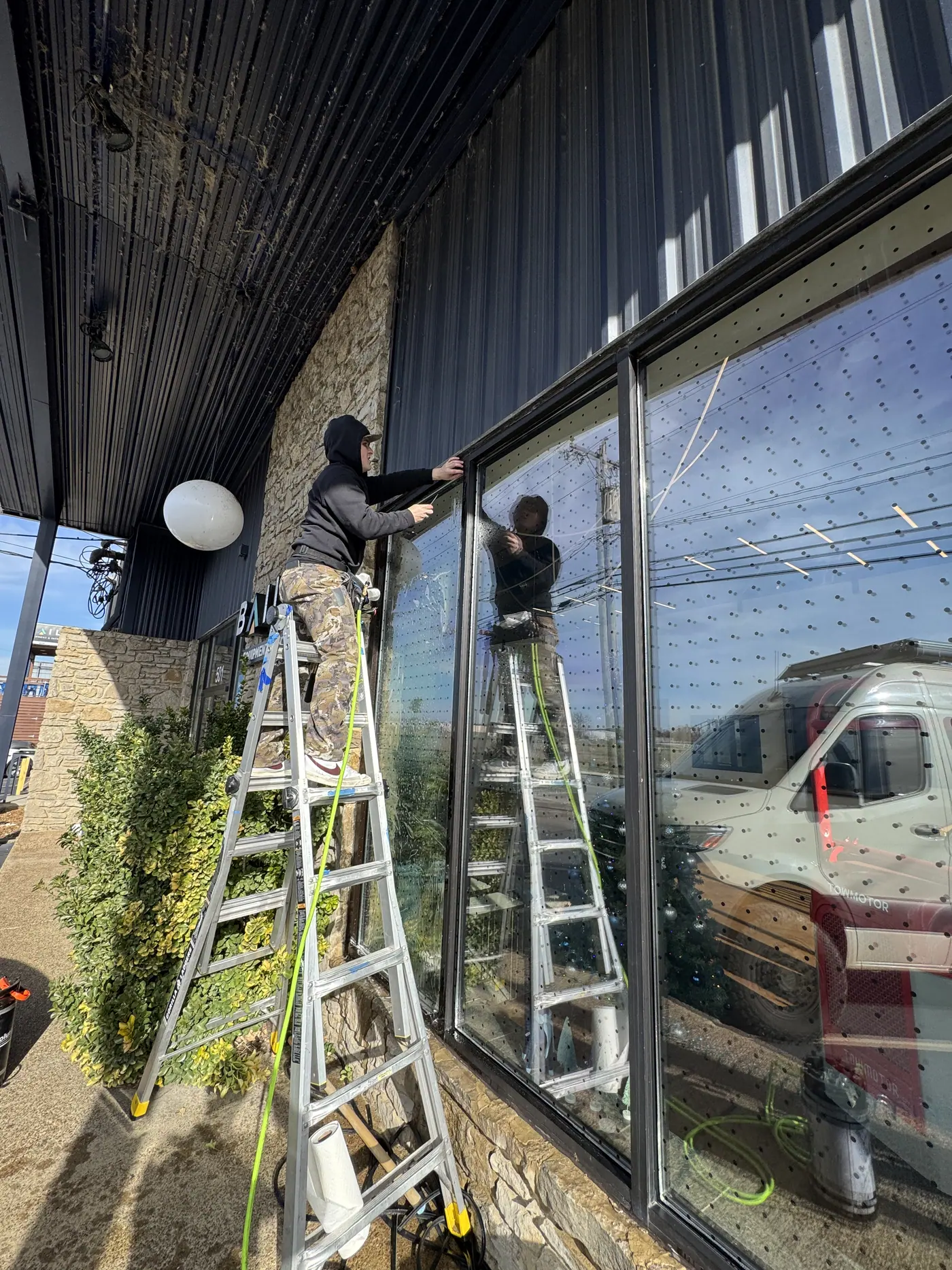 Installing bird strike film on exterior glass