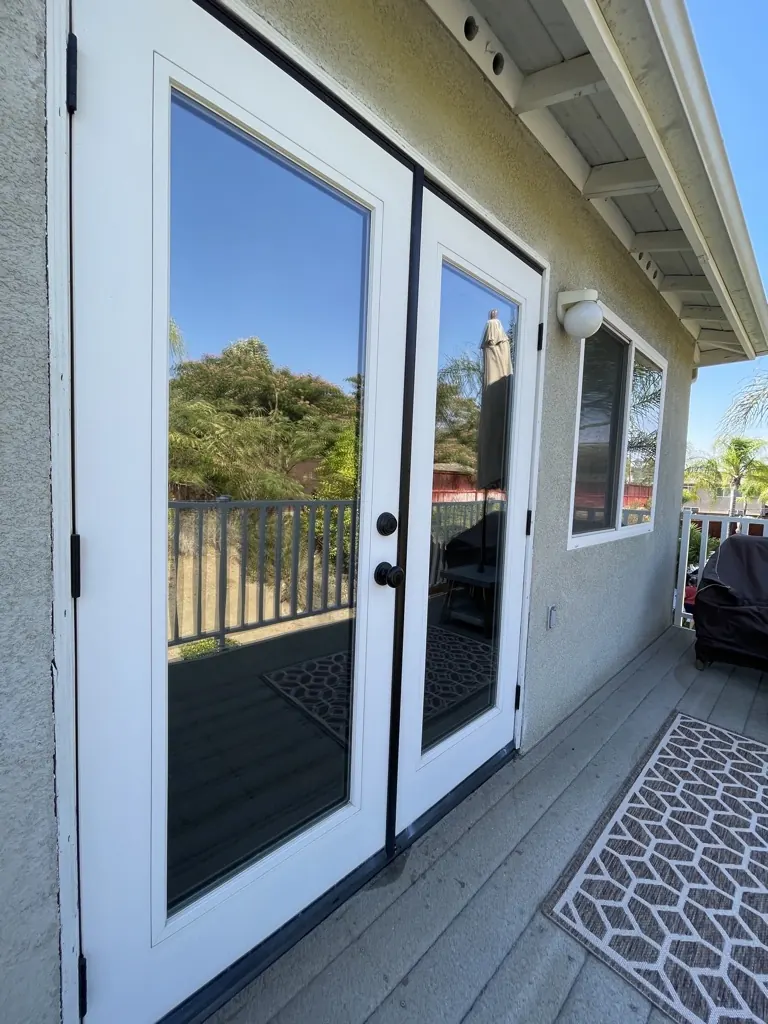 French doors onto a sunny deck