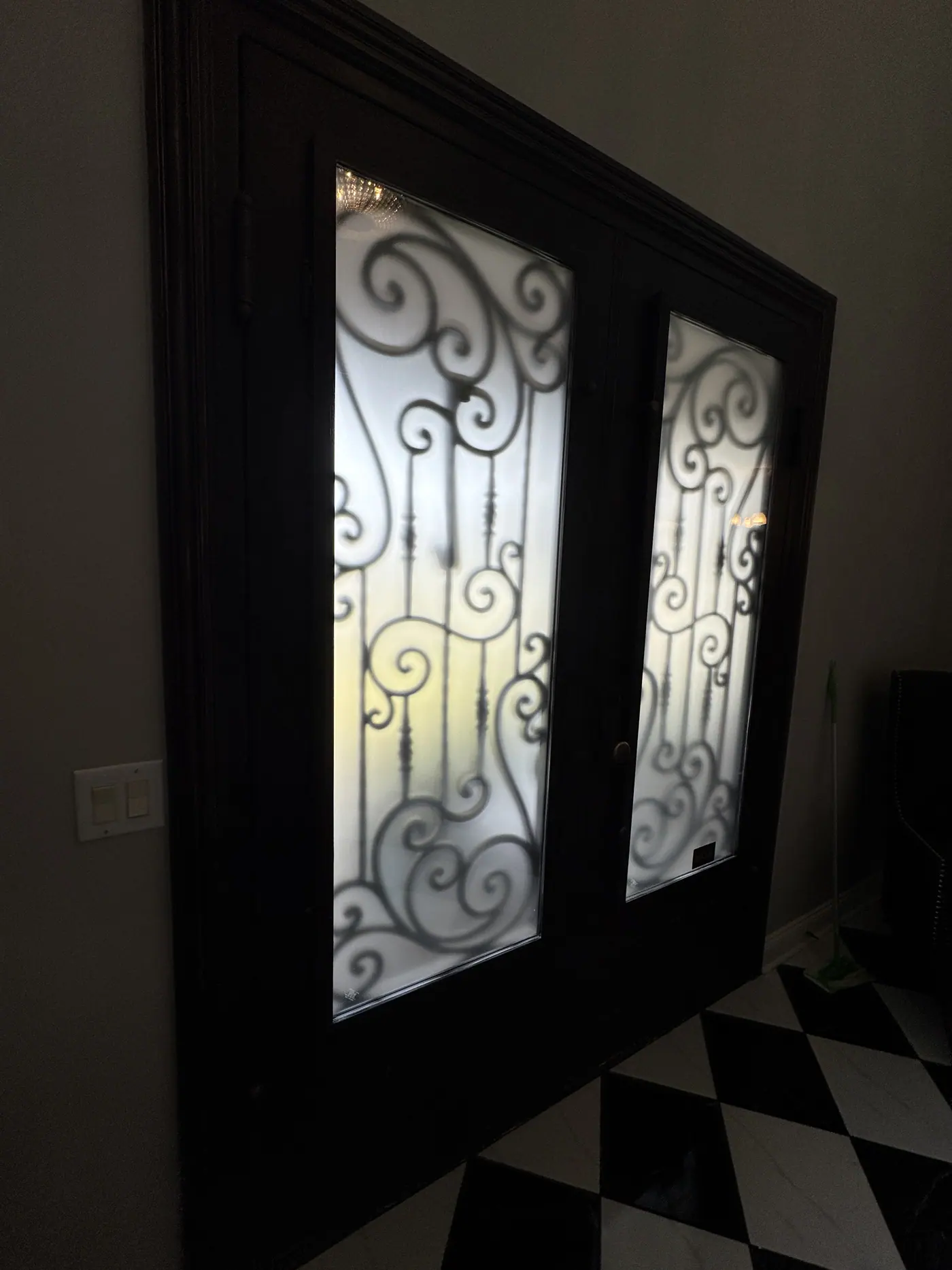 Iron entry door with privacy film