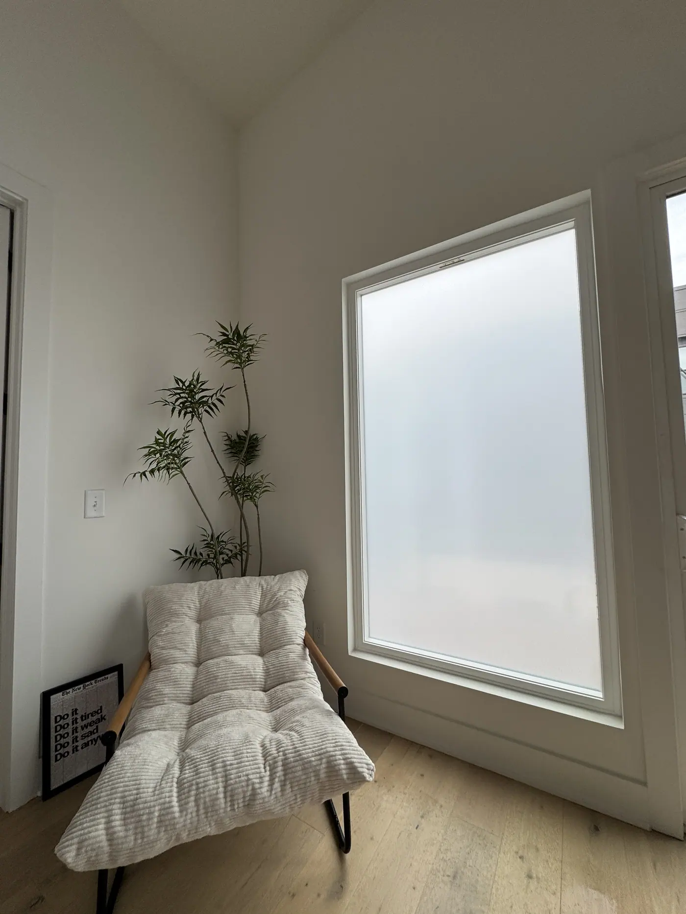 Full frost on a tall window, daylight kept
