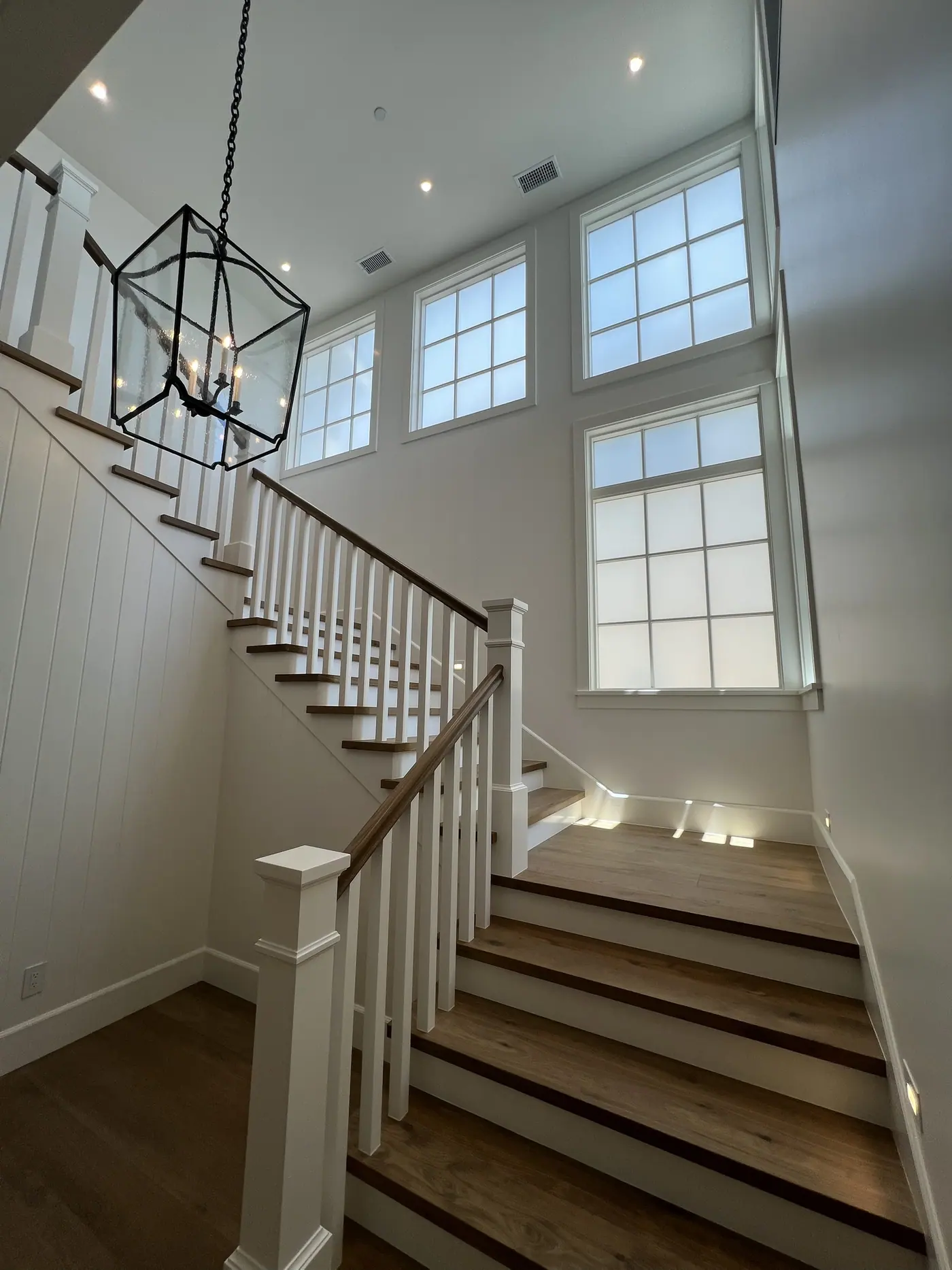 Frosted stairwell windows in a two-story entry