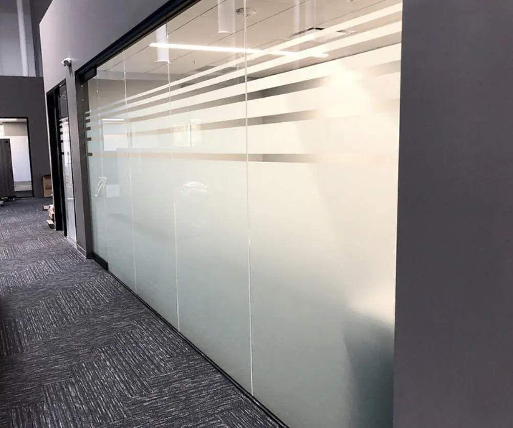 Frost stripes across a glass wall