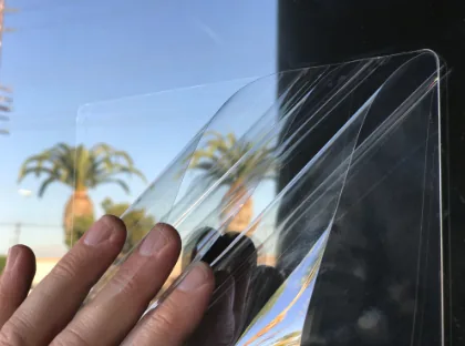 Clear Glass Shield anti-graffiti film being peeled back