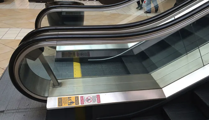 Stainless escalator side and deck panels