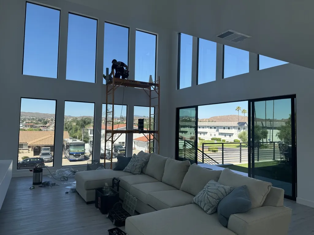 Filming two-story glass from scaffolding
