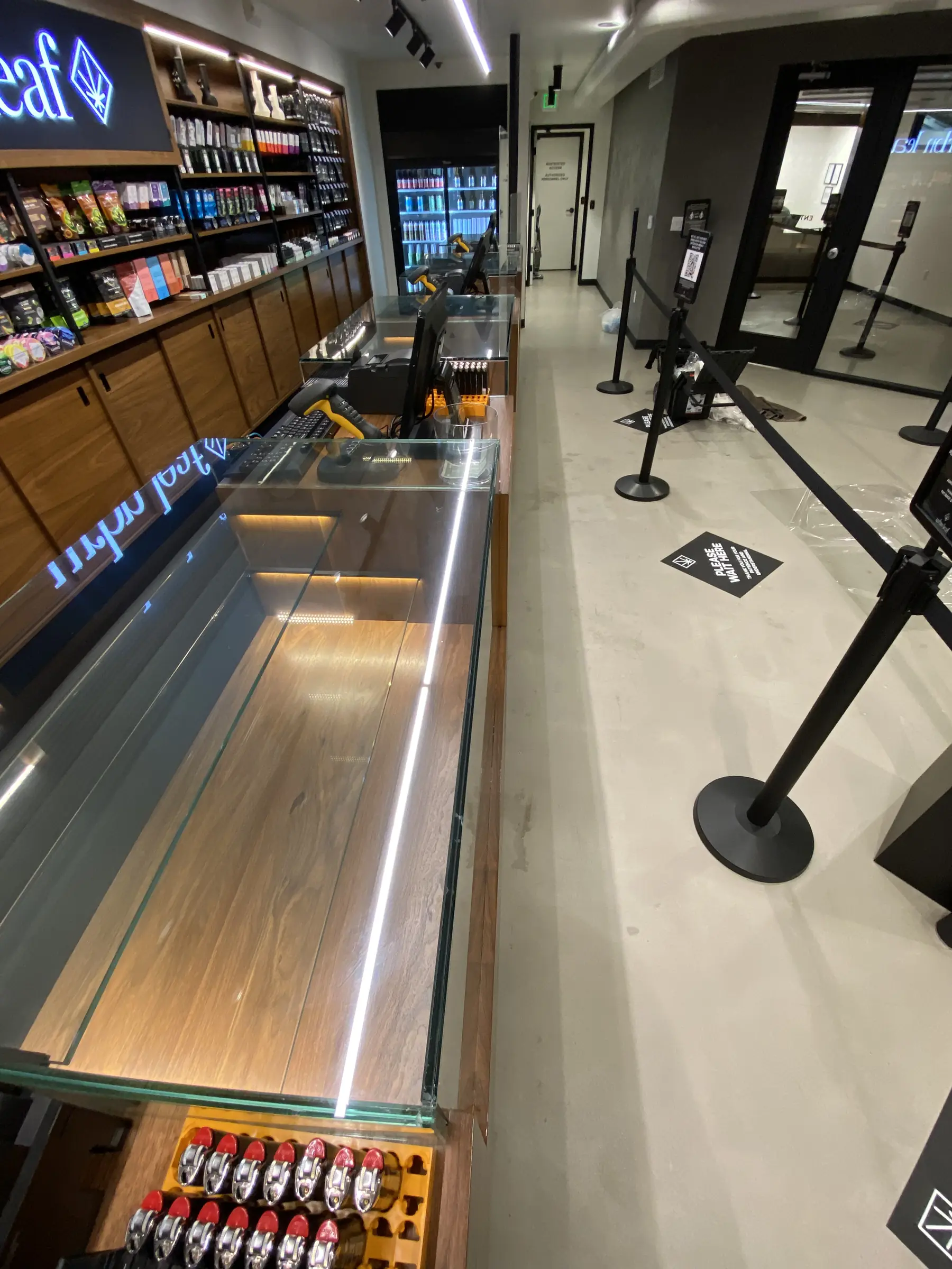 Long run of glass display cases with protective film