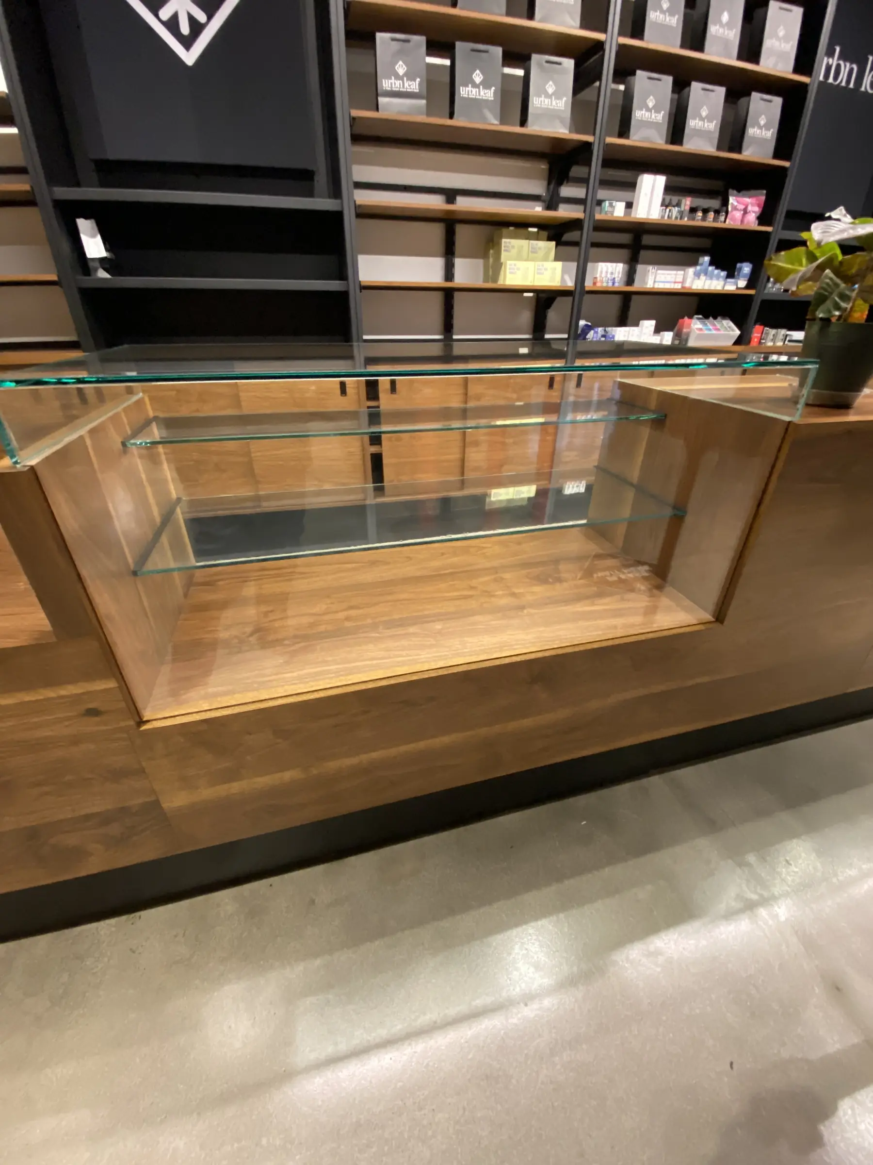 Glass-topped display counter with security film