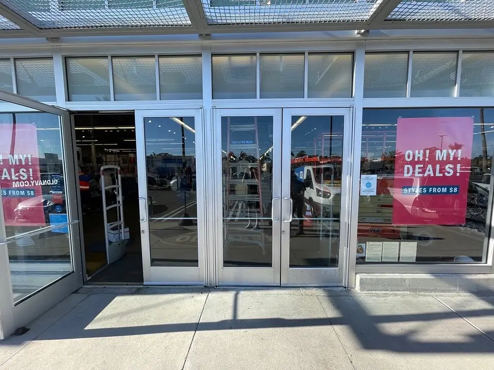 Retail outlet storefront with protective film on doors and windows