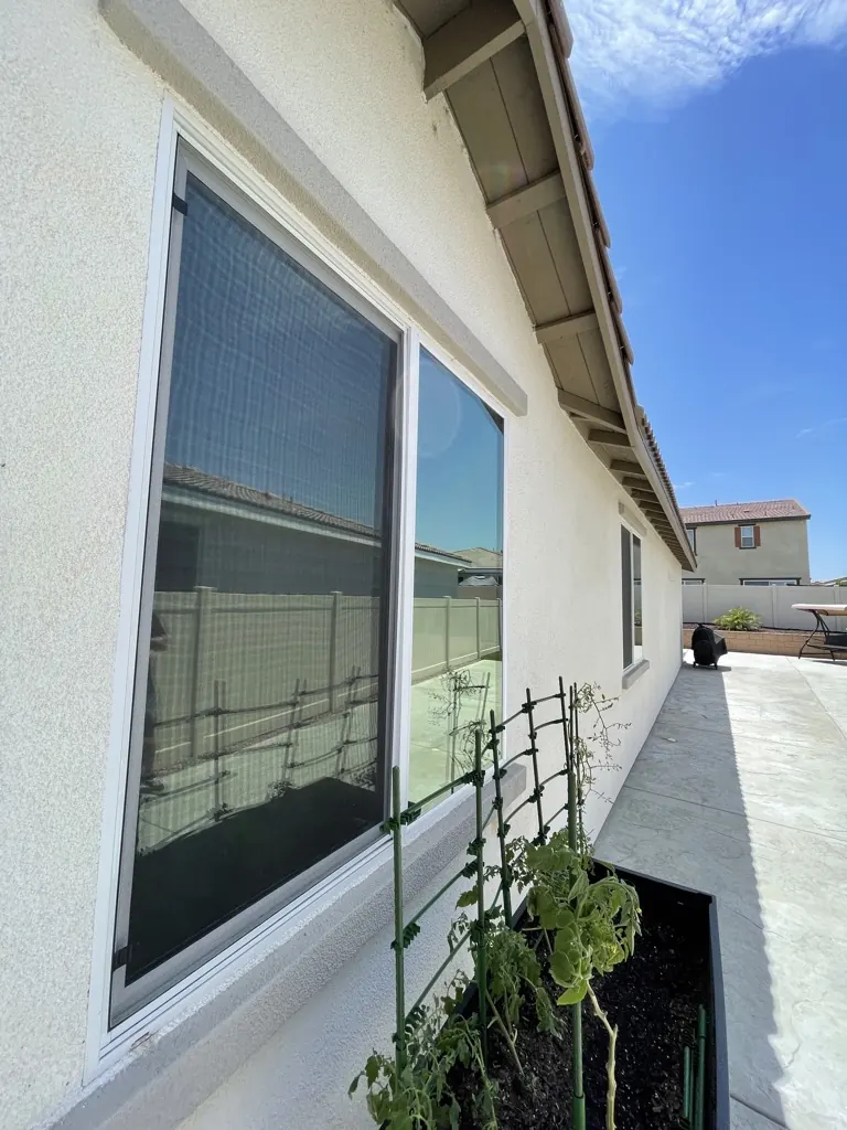 Side windows on a Temecula-area home filmed by Tint Solutions