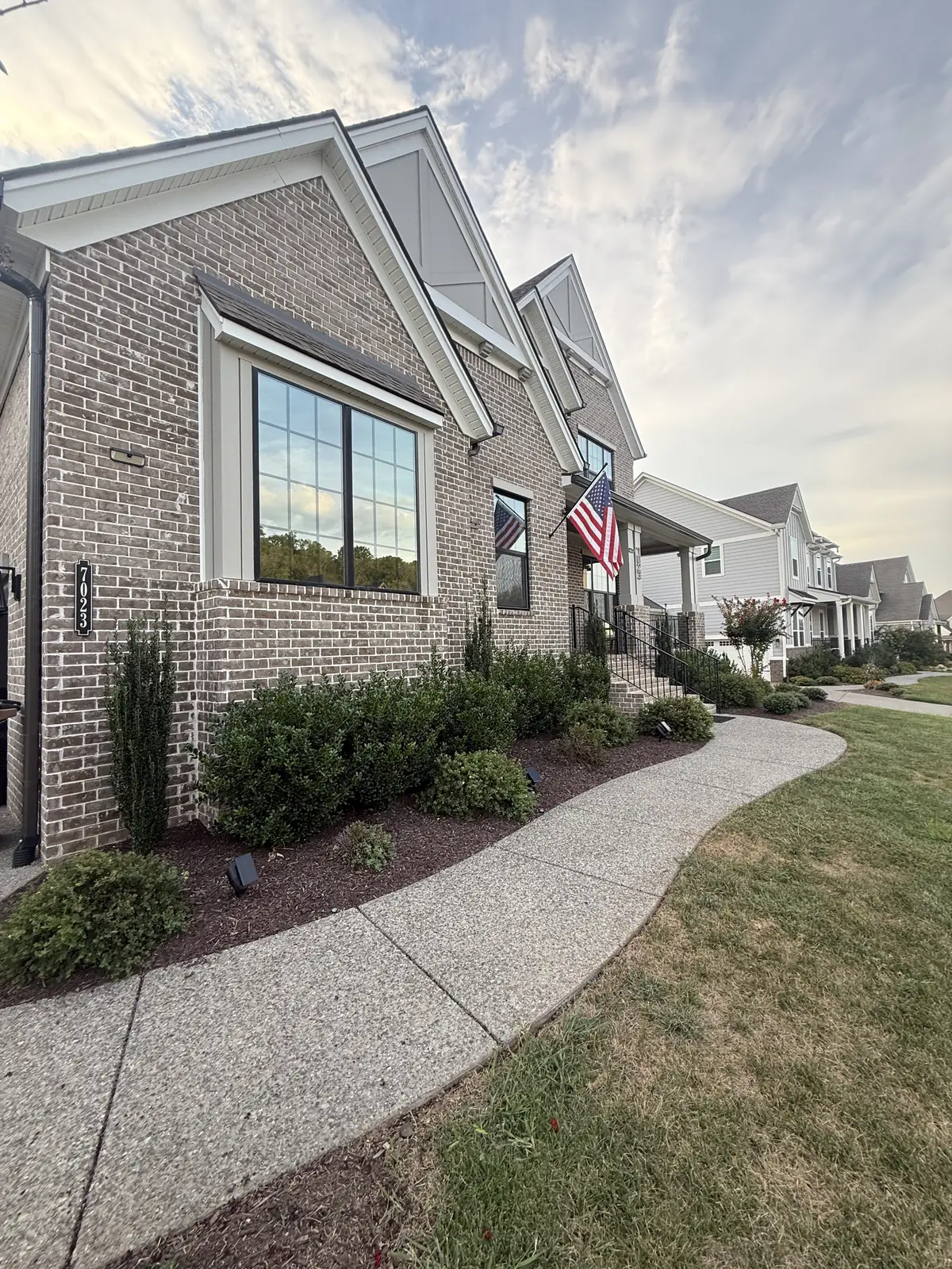 Brick Middle Tennessee home with a large gable-front window