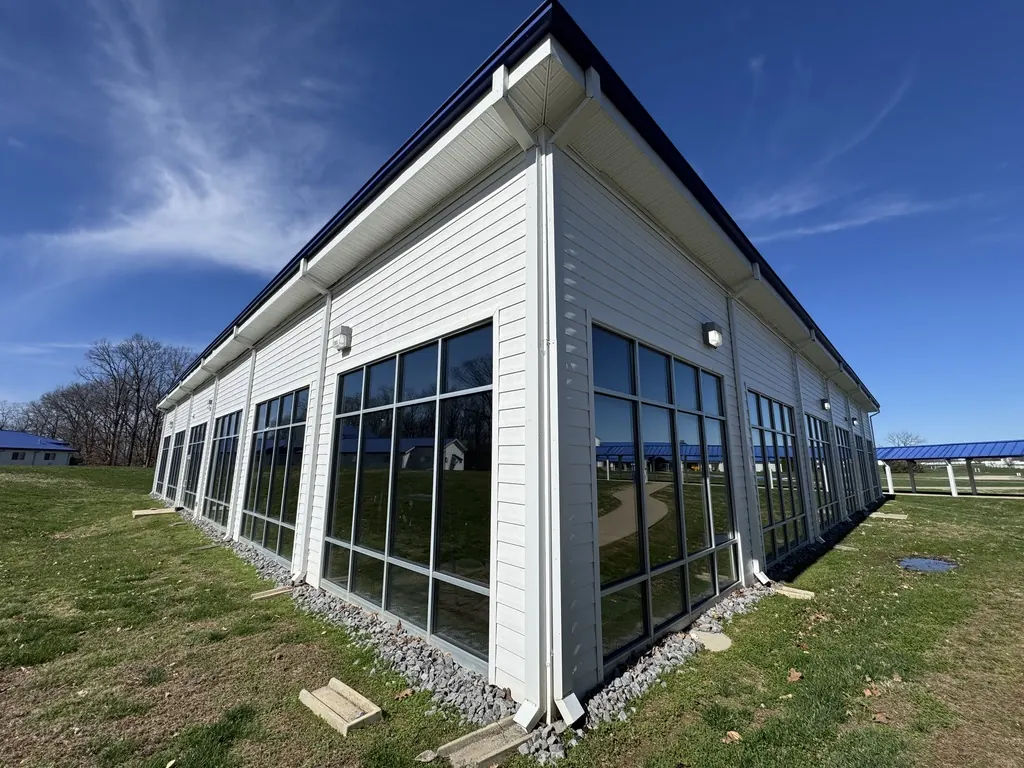 Corner of a building with tall window bays and window film