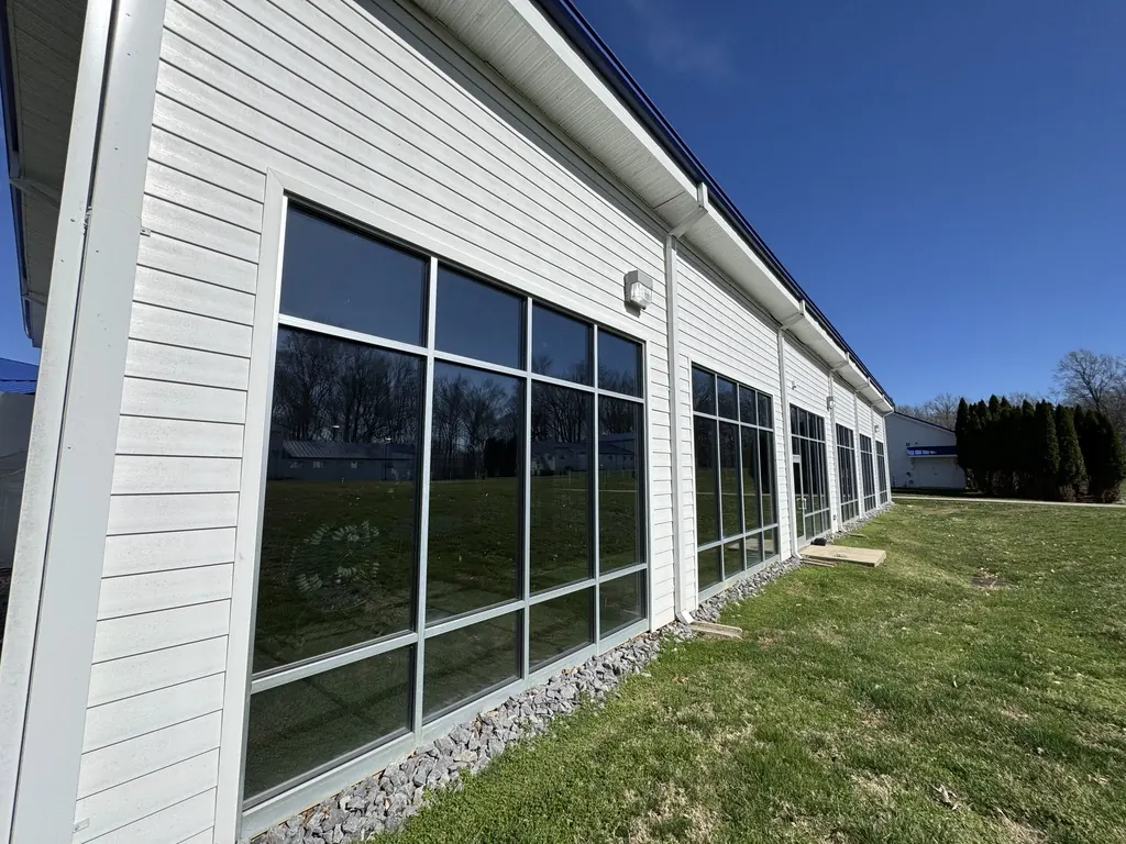 Floor-to-ceiling window bay with reflective window film