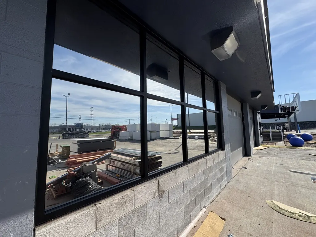 New commercial storefront windows on a building under construction