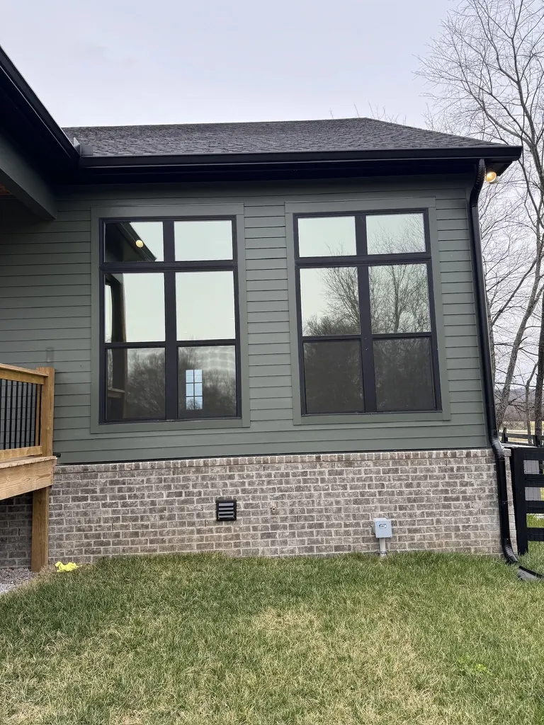 Two large grid windows on a Middle Tennessee home with window film