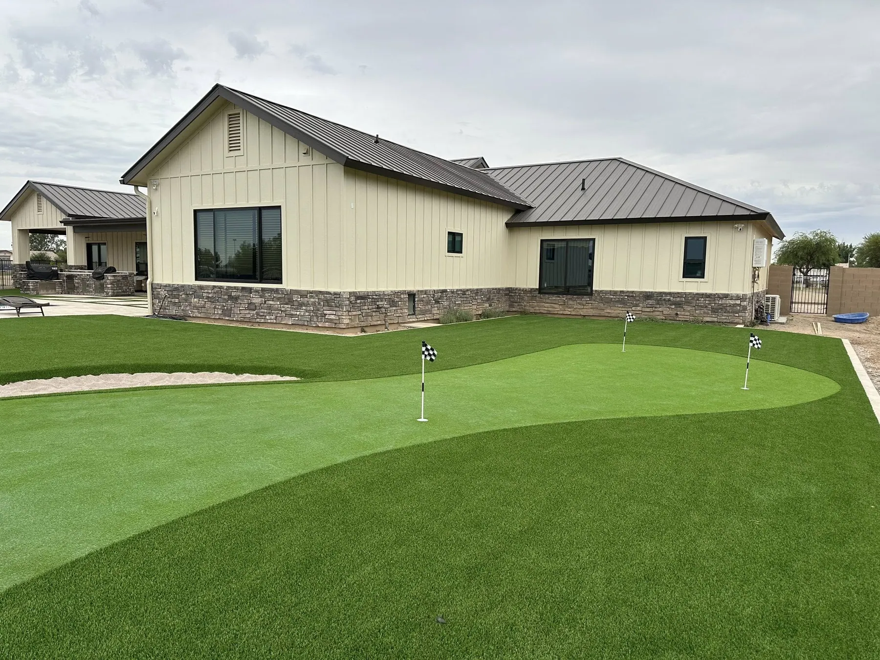 Backyard putting green, turf protection film