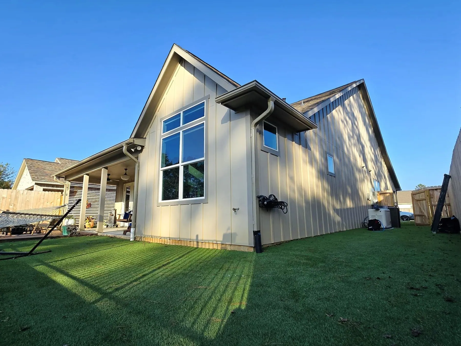 Two-story home over artificial turf