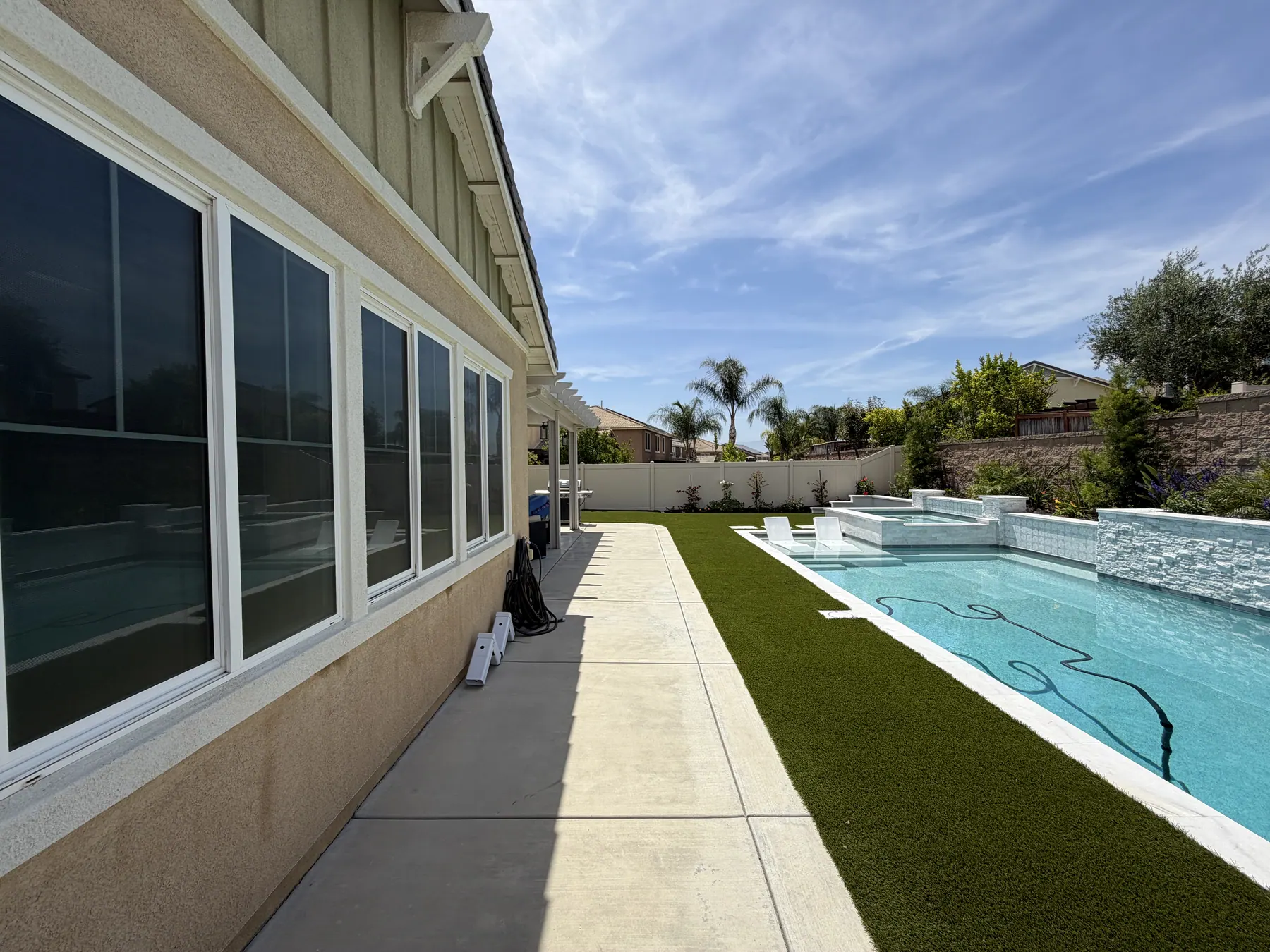 Long run of windows over turf, Solyx Reflect Protect