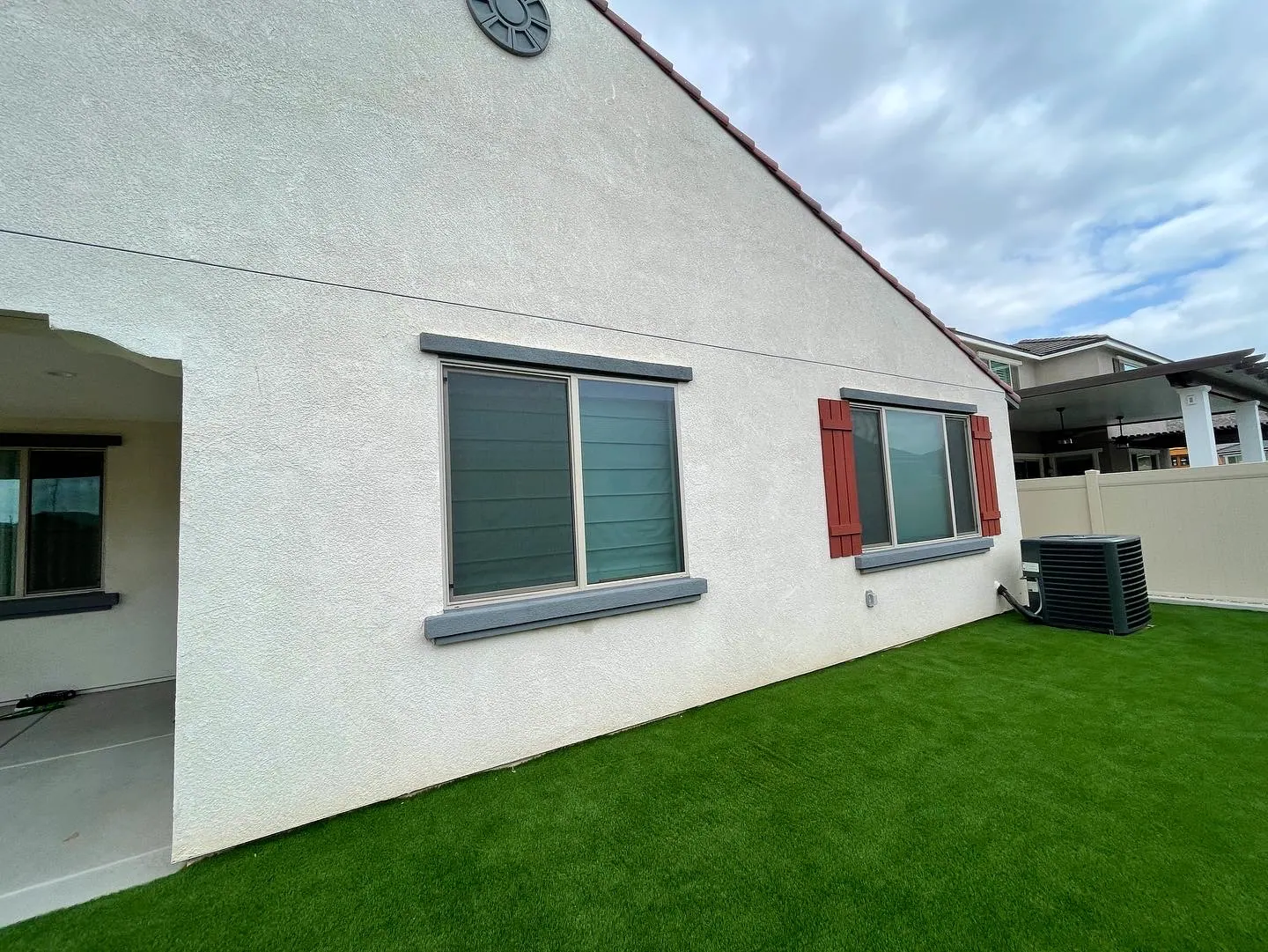 Upper windows over a turf yard